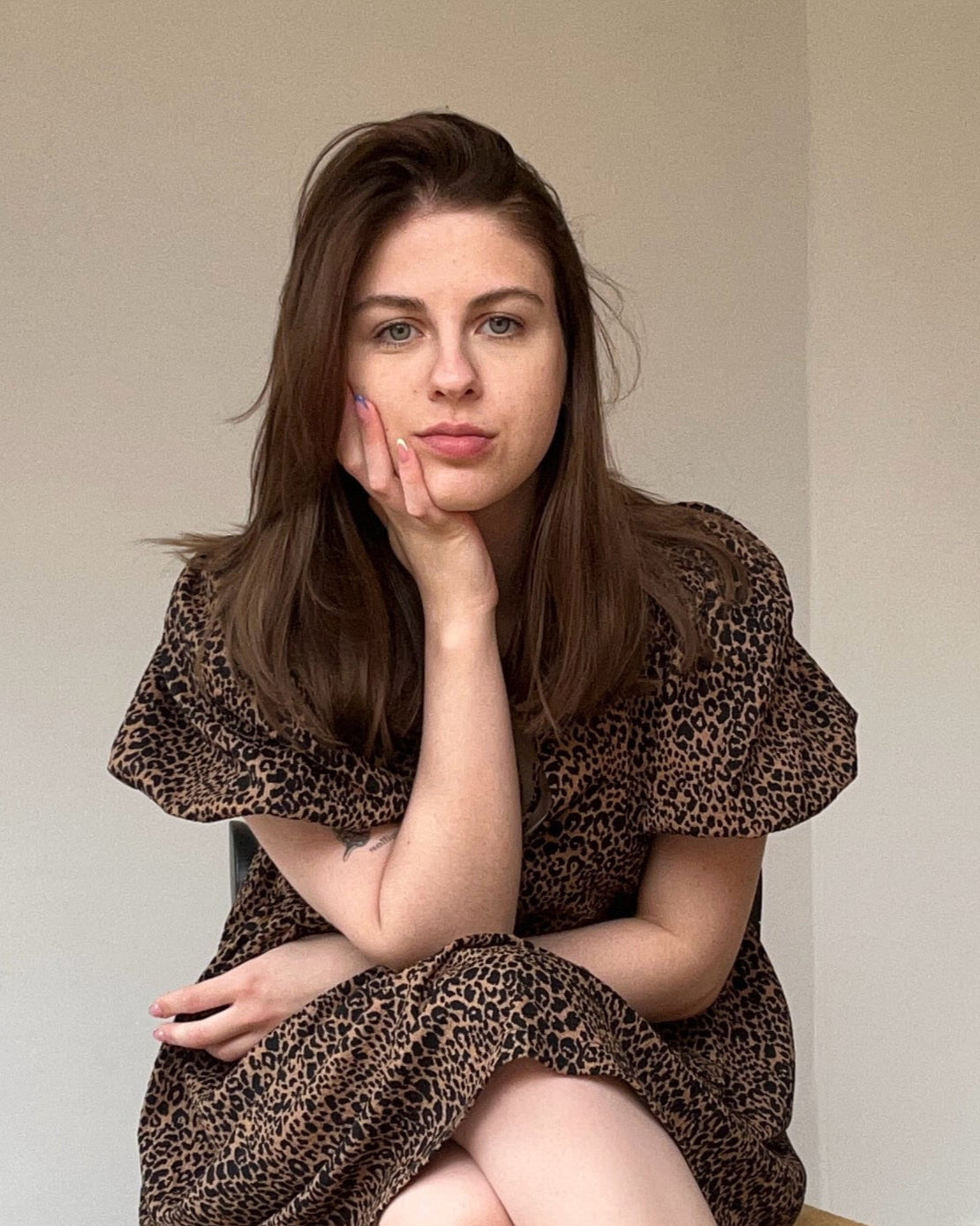 Jasmine Ely, founder of Hummingbird Paper Co, seated in a calm, thoughtful moment. Creator of luxury personalised vegan leather planners designed for intentional living.