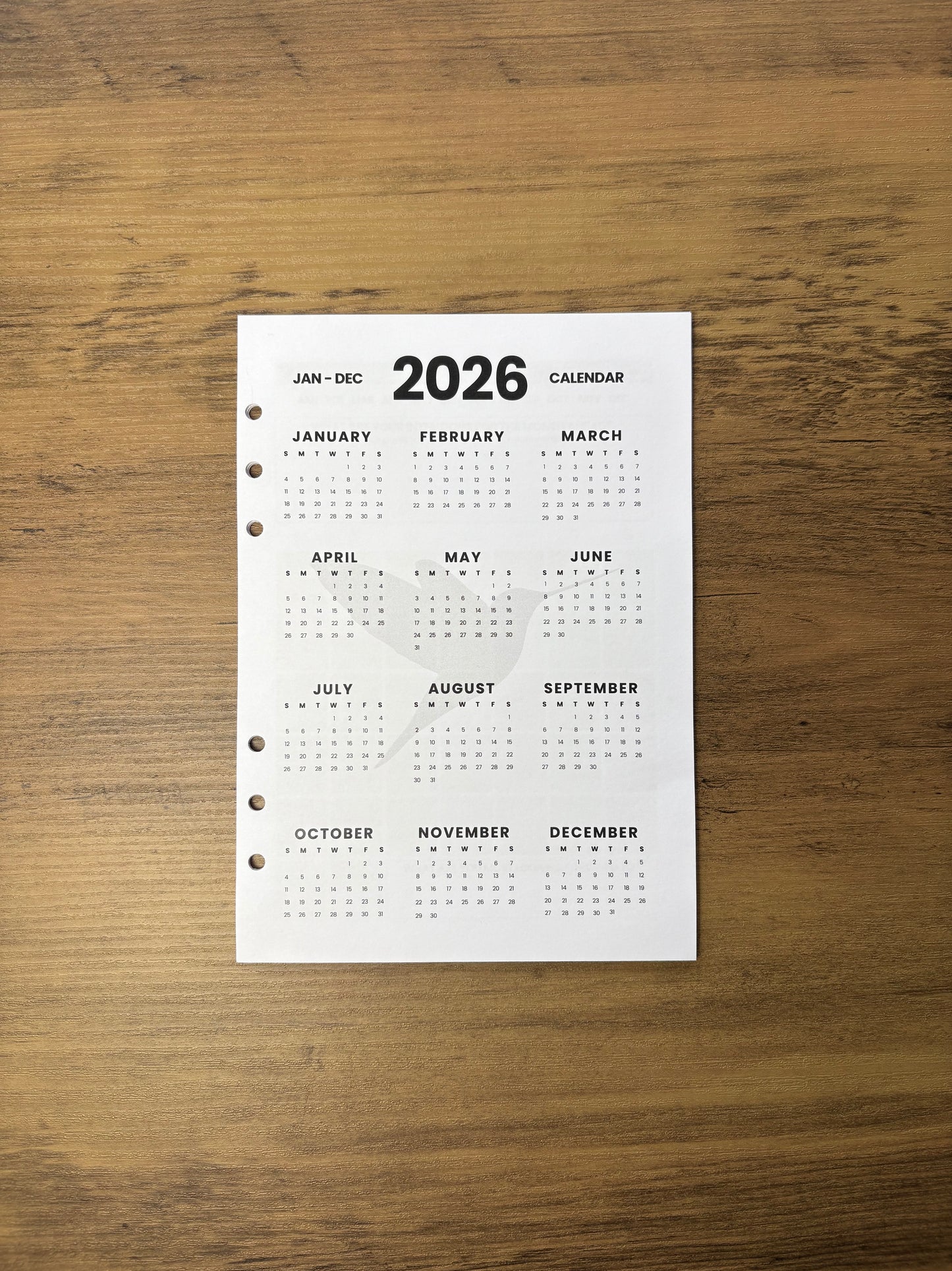 Image of the 2026 Hummingbird Paper Co Planner Base on on a wooden surface
